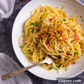 Pantry-Friendly Recipes: Delicious Meals from Store Cupboard Staples 12 Spaghetti with garlic breadcrumbs and red chilli on a white plate