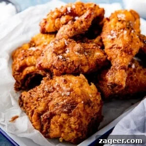 Crispy Fried Chicken Recipe for Perfectly Crunchy Skin 10 Pieces of crispy fried chicken on a tray