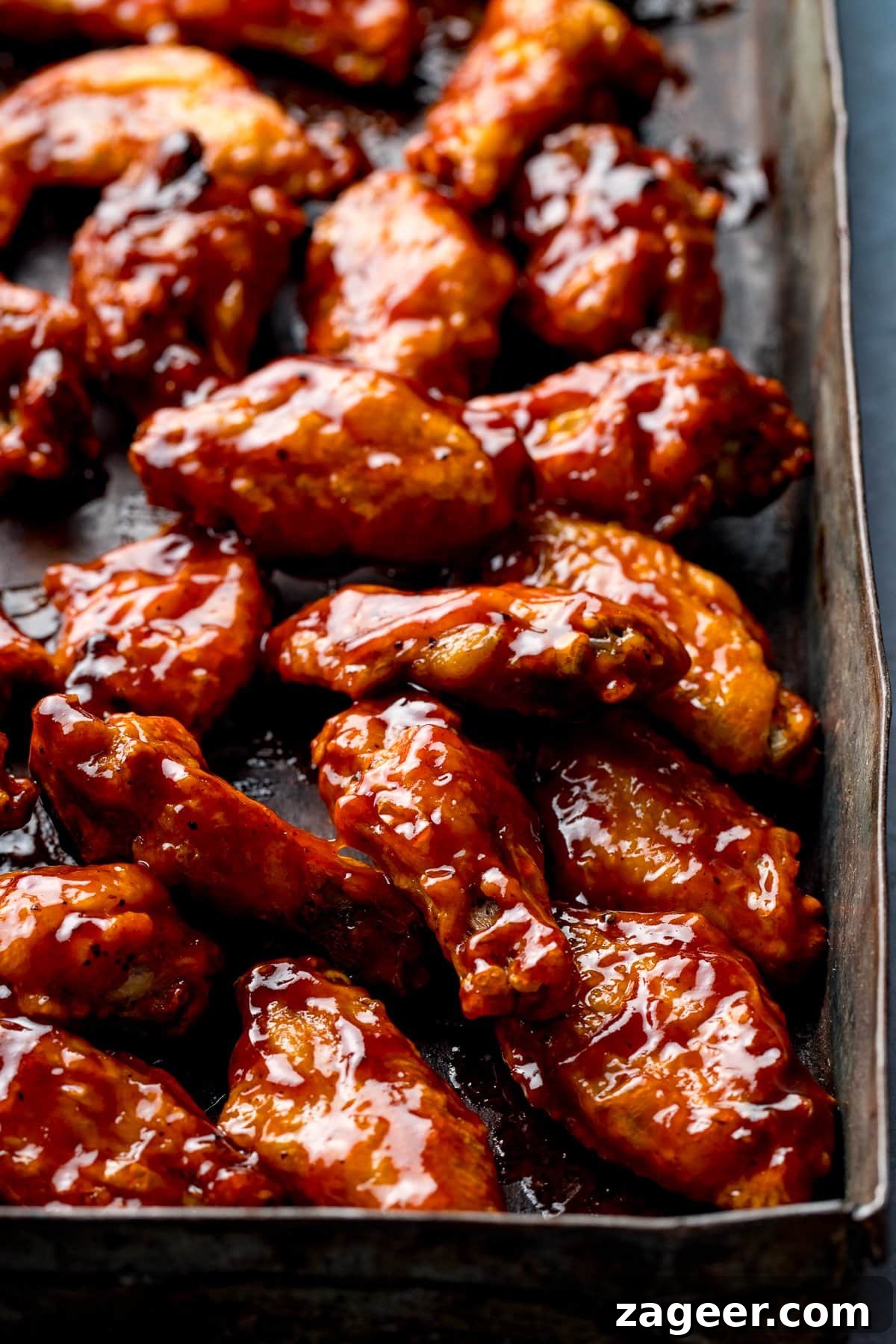 Perfect BBQ Chicken Wings Recipe: Juicy, Crispy & Smoky 11 BBQ chicken wings on a baking tray
