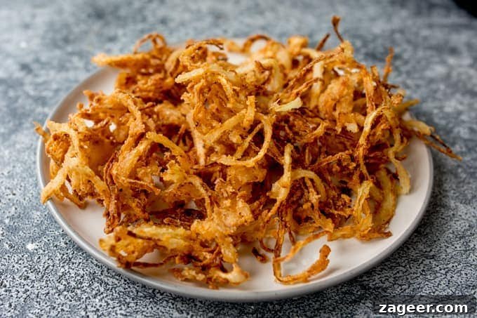 Hearty Beef and Guinness Stew Topped with Crispy Fried Onions 4 Plate of crispy fried onions