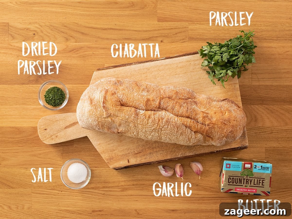 Quick Homemade Garlic Bread Recipe for Crispy, Flavorful Slices 4 Ingredients for making garlic bread on a wooden table