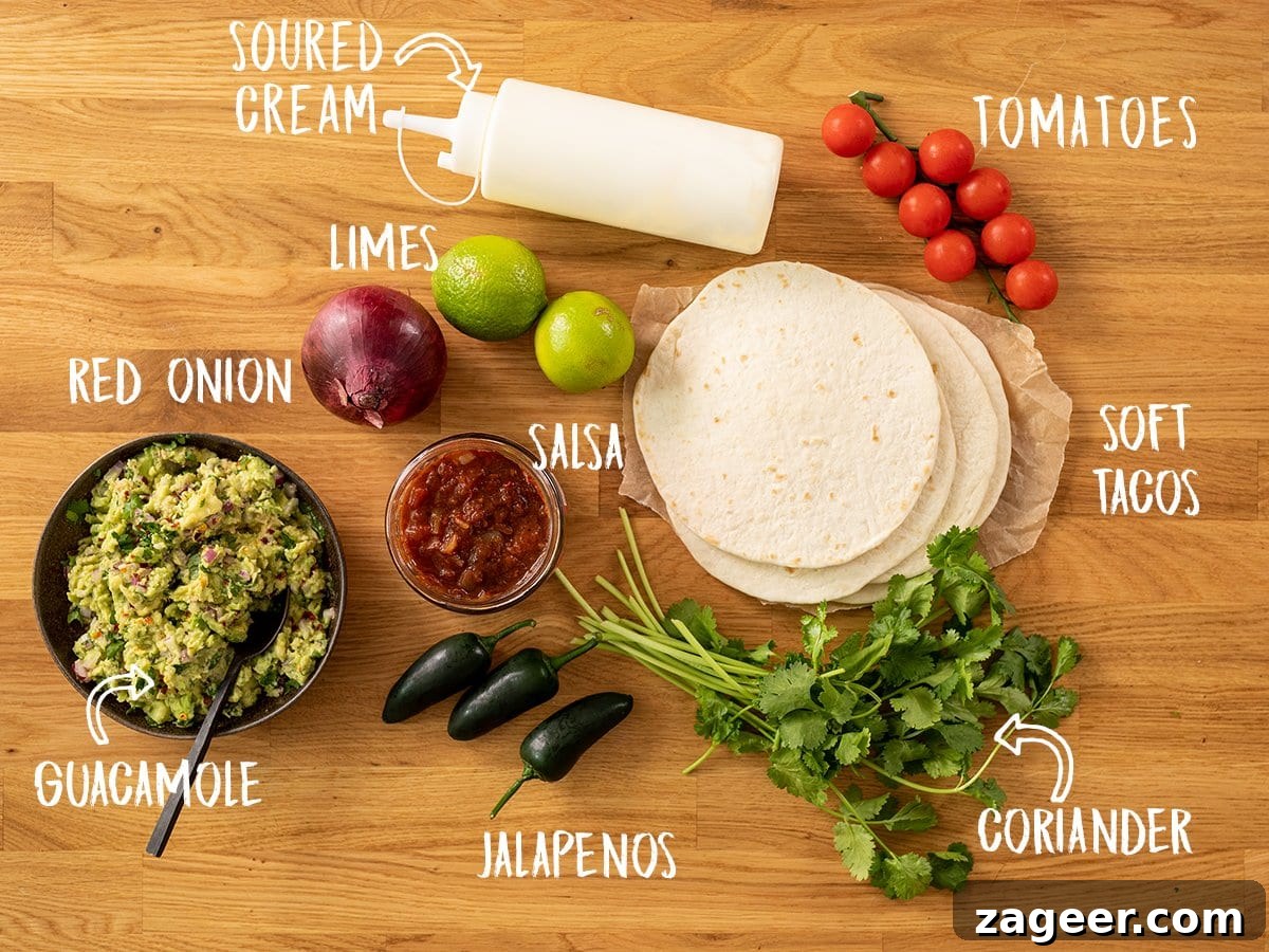 Authentic Lamb Barbacoa Recipe — Slow-Cooked Mexican-Style Lamb 4 Tacos and toppings for lamb carnitas tacos on a wooden board