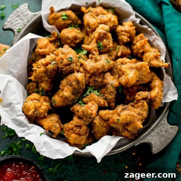 Authentic Pilau Rice Recipe: Aromatic Spiced Pilaf Instructions 11 chicken pakoras in a bowl next to a green napkin