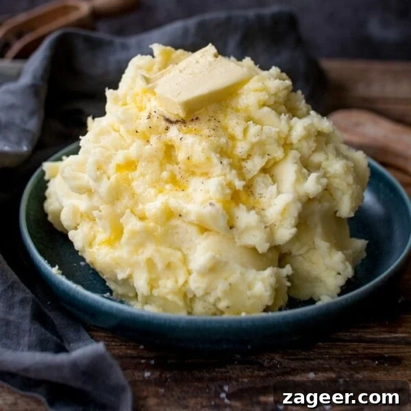 Perfectly Crispy Fondant Potatoes: Classic Oven-Roasted Recipe 14 Pile of mashed potatoes with butter on top