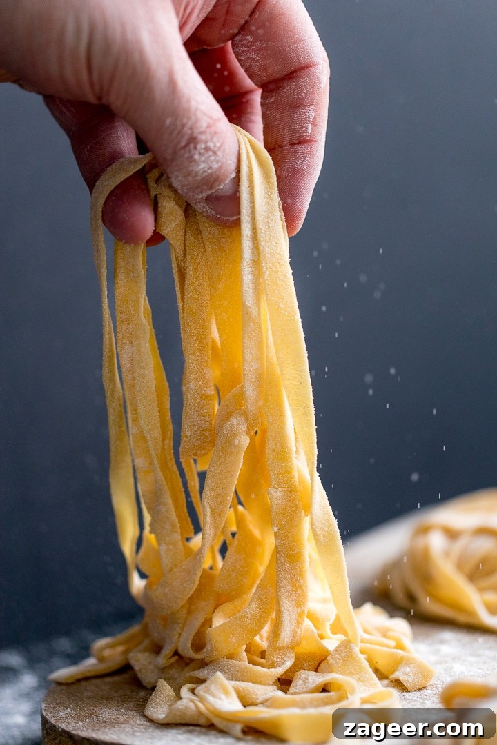 Turkey Bolognese from Leftover Roast: Quick Family Dinner 6 homemade tagliatelle being lifted off a board