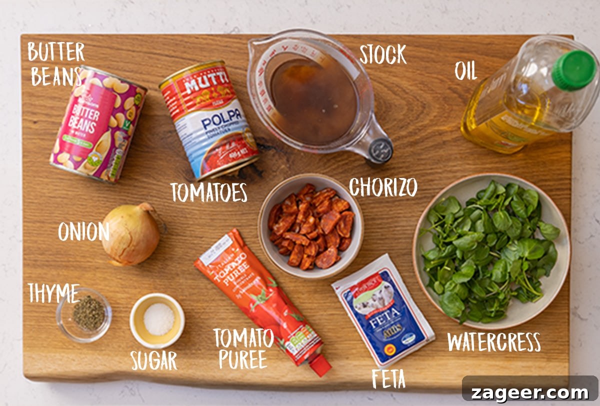 20-Minute Chorizo and Butterbean Soup Recipe 3 Ingredients for butterbean and chorizo soup on a wooden board.