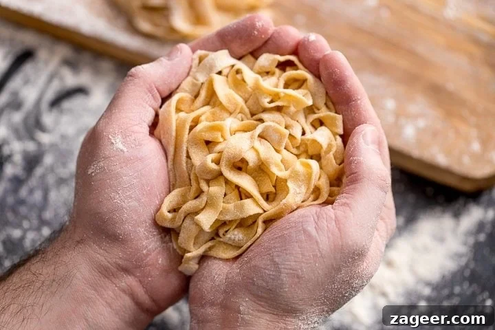 Creamy Tomato Sauce for Ravioli: Quick Weeknight Recipe 6 Wide image of Homemade tagliatelle cupped in two hands