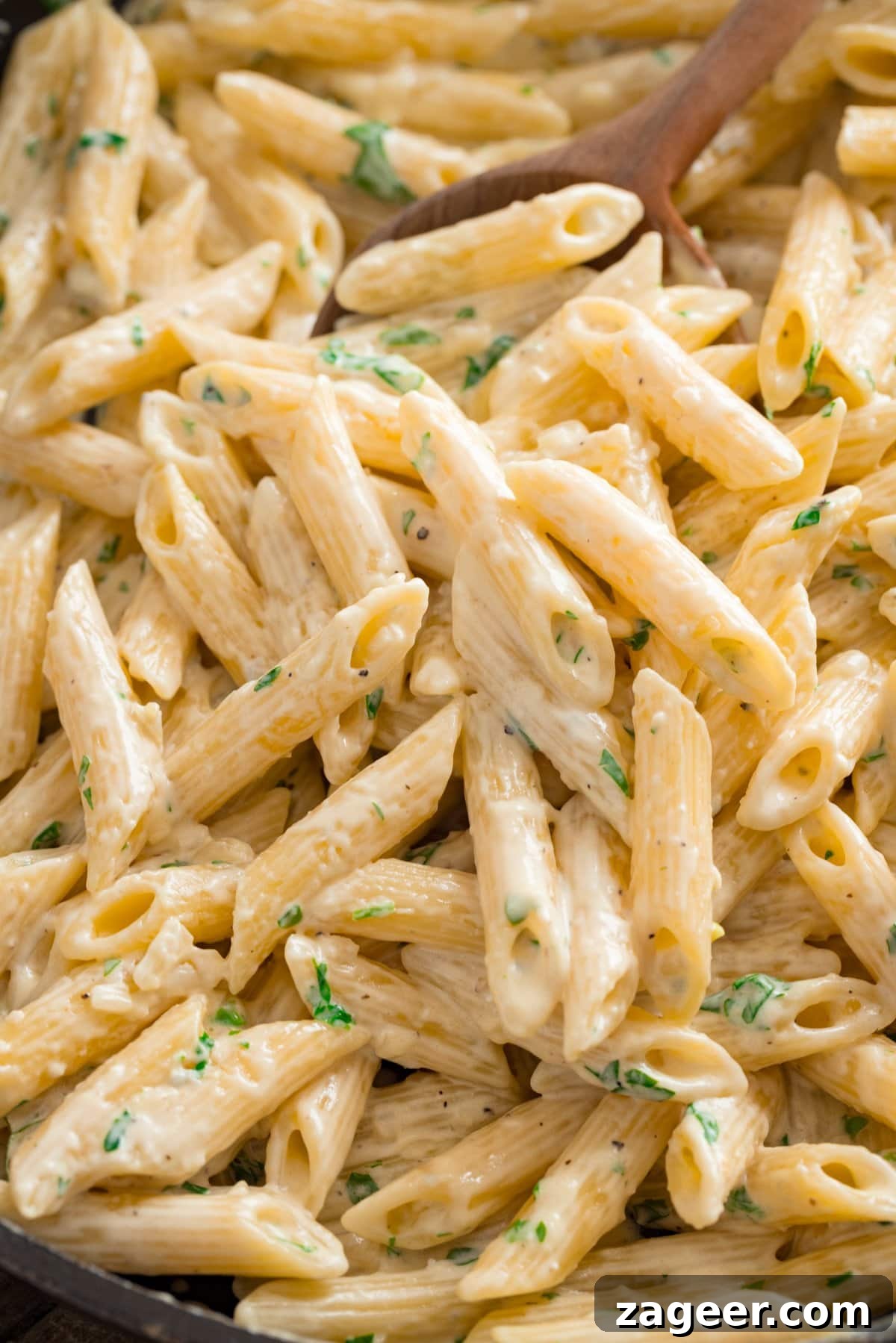 Creamy Gorgonzola Pasta with Garlic and Walnut Crumble 5 Close up of gorgonzola pasta in a pan.
