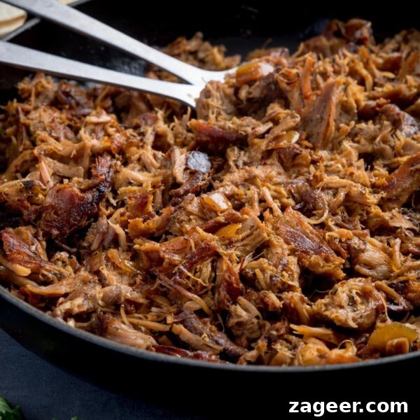 Authentic Lamb Kofta Recipe with Tangy Yogurt Sauce 11 Square image of a pan of pork carnitas being fried.