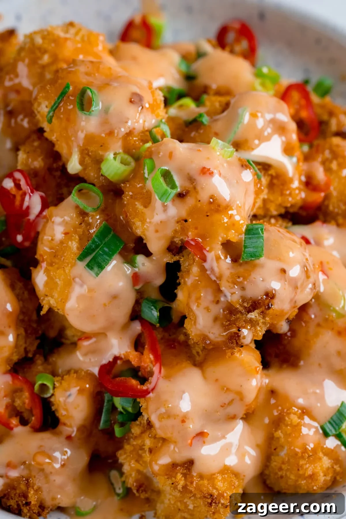 Sichuan Bang Bang Chicken Salad Recipe: Spicy Sesame Chicken 2 Crispy chicken pieces smothered in bang bang sauce, topped with spring onions and chillies