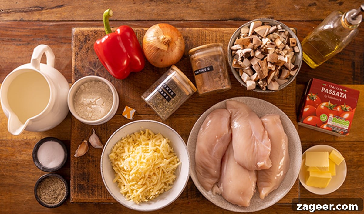 Lasagna-Style Baked Chicken Casserole Recipe 3 Ingredients for lasagne style chicken bake on a wooden board.