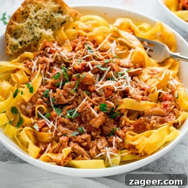 Rich Red Wine Jus Recipe for Steaks and Roasts 10 slow cooked pork ragu in a white bowl with pasta and garlic bread