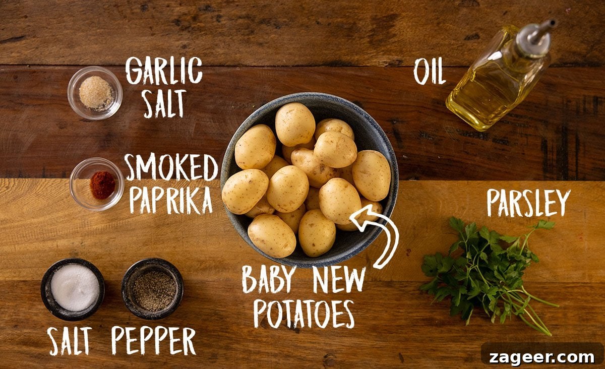 Crispy Garlic Smashed Potatoes Recipe for Perfectly Crispy Skins 4 A wooden table with all of the ingredients for smashed potatoes laid out separately