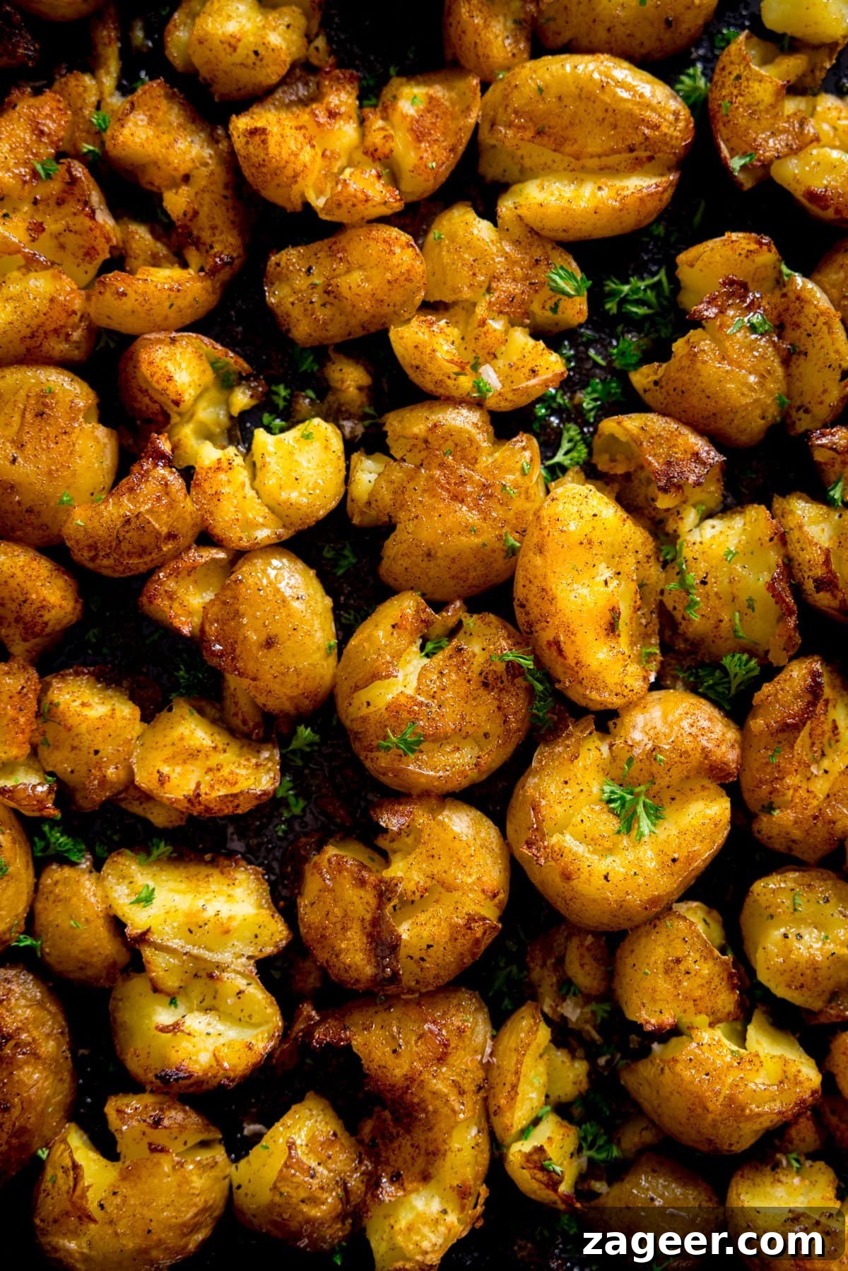Crispy Garlic Smashed Potatoes Recipe for Perfectly Crispy Skins 5 A tray of crispy smashed potatoes sprinkled with parsley