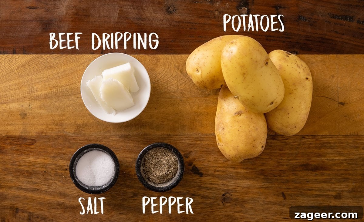 Perfectly Crispy Baked Potato: Foolproof Oven Method 3 Overhead photo of some large jacket potatoes, beef dripping, salt and pepper on a wooden background.