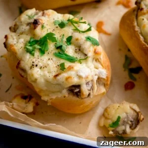 Creamy Garlic and Mushroom Stuffed Bread Rolls 12 Square close up image of Cheesy Mushroom Stuffed Garlic Breads topped with parsley.