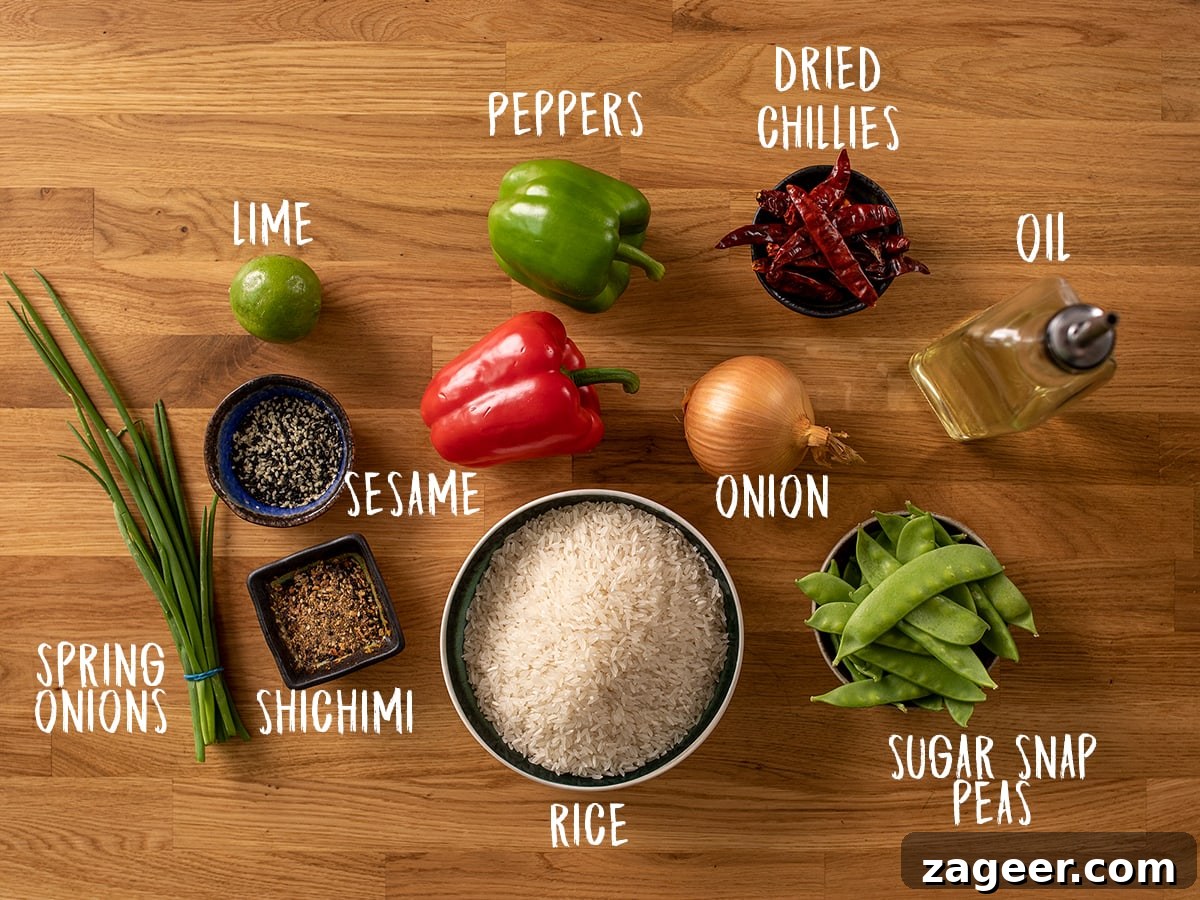 Spicy Firecracker Chicken Recipe with Crispy Bites 6 Firecracker stir fry and rice ingredients on a wooden background