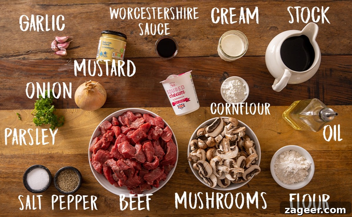 Ingredients for slow cooker beef stroganoff on a wooden table