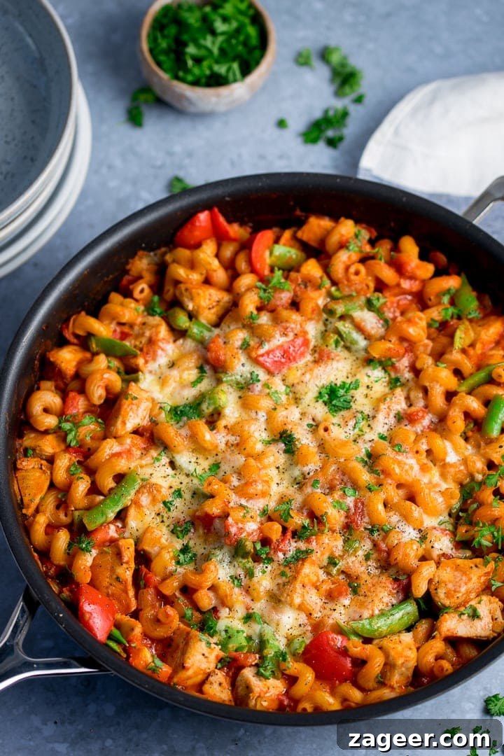 30-Minute One-Pot Chicken Pasta Recipe for Busy Weeknights 5 One pot chicken pasta in a skillet on light blue background
