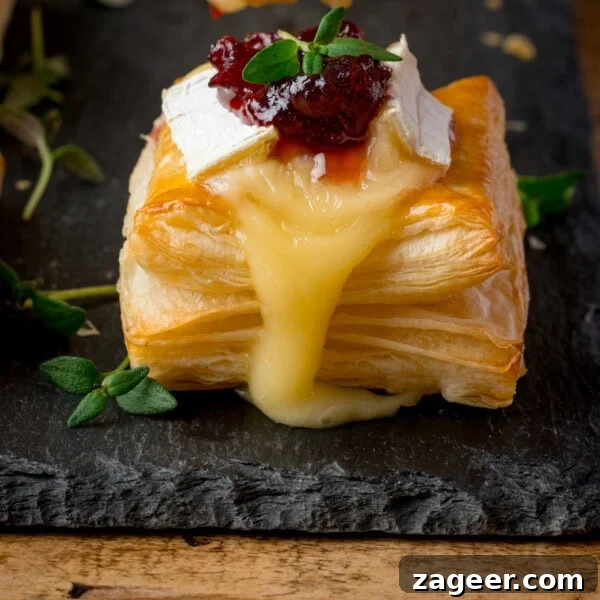 Cheesy Baked Potato Croquettes: Crispy Oven-Baked Recipe 9 Square puff pastry topped with melted brie cheese and cranberry sauce