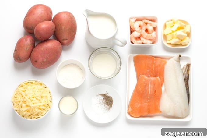 Ingredients for fish pie on a white board