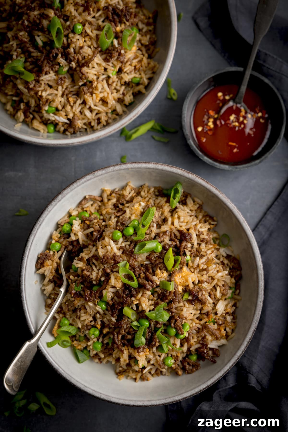 Beef Mince Fried Rice Recipe: Flavorful One‑Pan Dinner 5 Overhead image of a bowl of minced beef fried rice, with a fork sticking out.