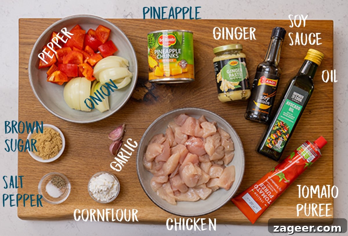 Sticky Pineapple Chicken Recipe with Sweet Tangy Glaze 3 Ingredient for sticky pineapple chicken on a wooden board.