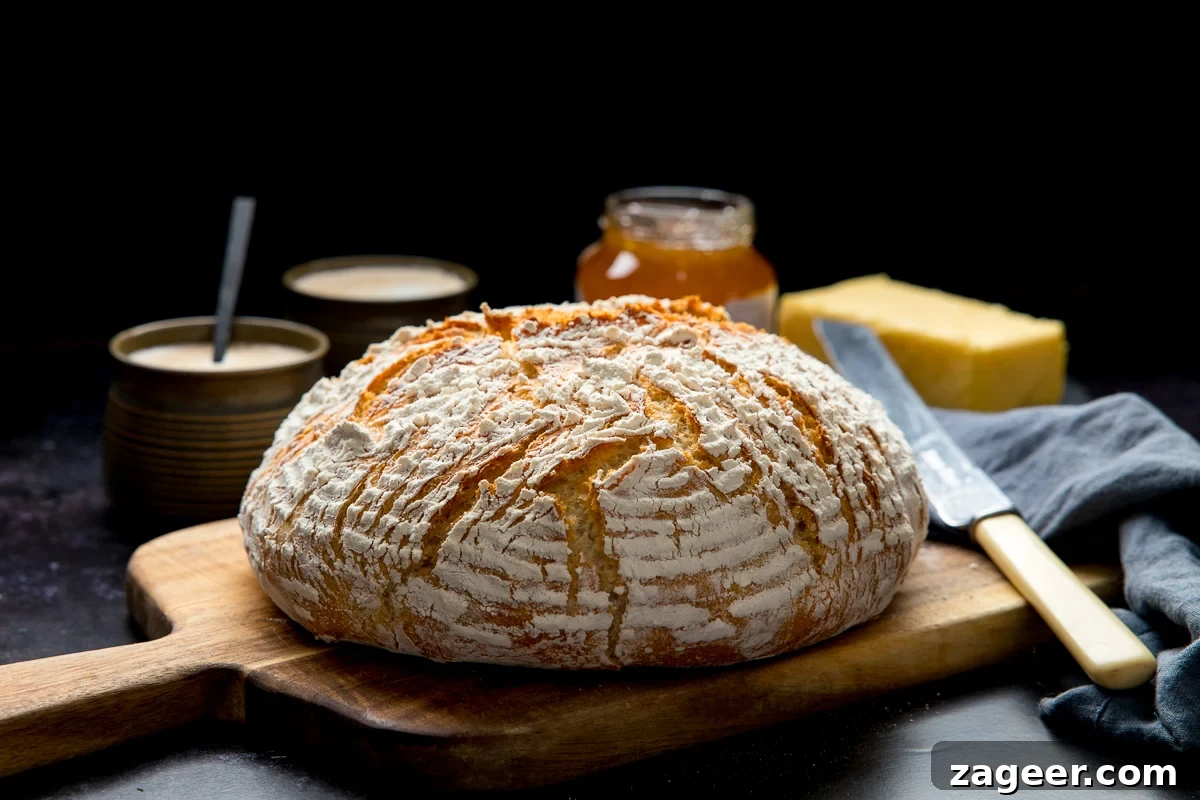 Classic Chicken and Rice Soup Recipe for Comforting Weeknight Meals 6 Wide image of a loaf of artisan bread on a wooden chopping board
