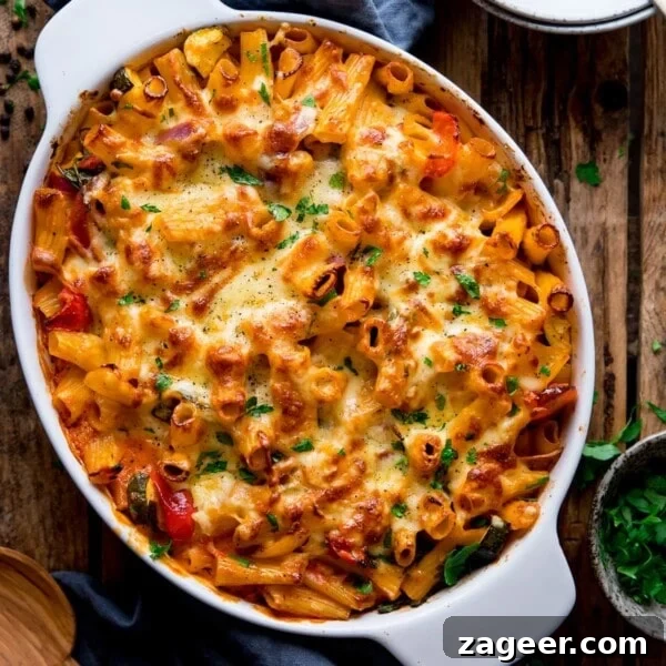 Roasted Veggie Pasta with Garlic and Parmesan 17 Vegetable pasta bake in a white dish.