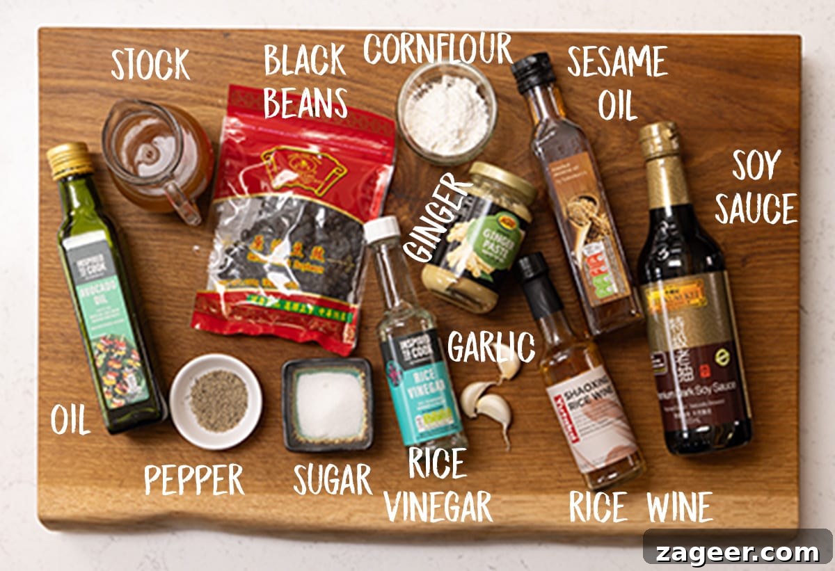Stir-Fried Beef in Savory Black Bean Sauce Recipe 4 Ingredients for homemade black bean sauce on a wooden board.