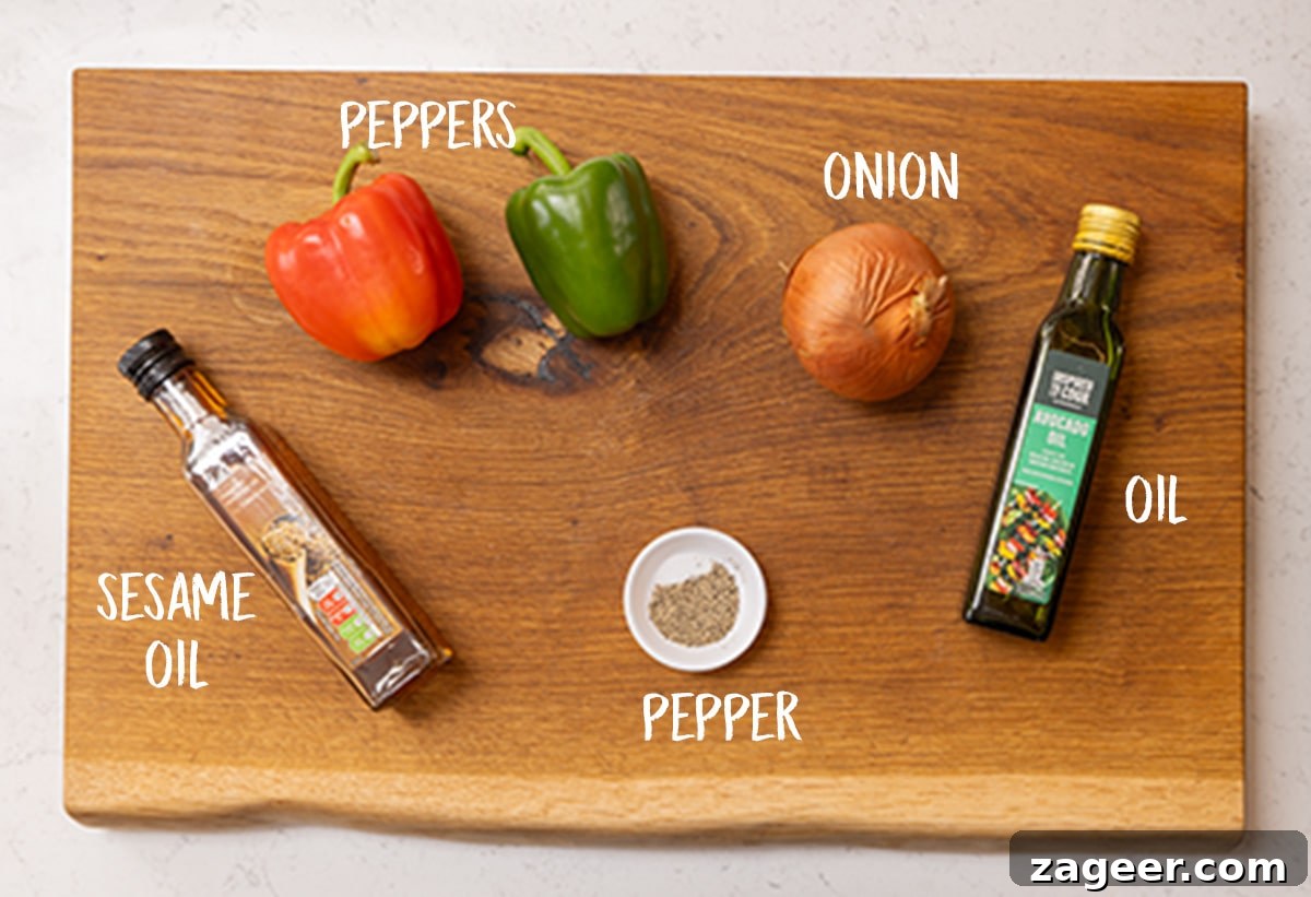 Stir-Fried Beef in Savory Black Bean Sauce Recipe 7 Peppers, onions, seasoning, sesame oil and avocado oil on a wooden board.