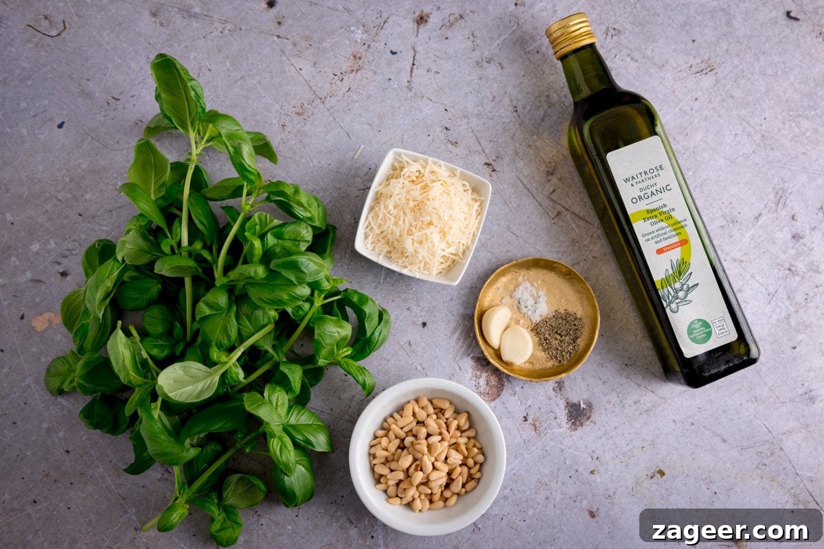 Creamy Basil Pesto Pasta with Garlic and Parmesan 3 Ingredients for homemade pesto on a light grey surface
