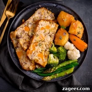 Savory Vegetarian Nut Roast Recipe for Holiday Dinners 7 Three slices of vegetarian nut roast on a dark blue plate