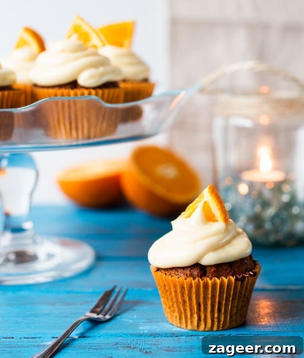Carrot and Orange Cupcakes with Zesty Cream Cheese Frosting 2 Moist and fluffy carrot & orange cupcakes with a hint of spice and lots of juicy raisins. All topped off with a zesty cream cheese frosting and orange wedges.