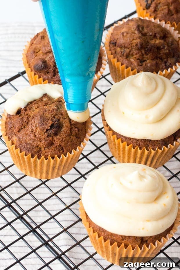 Carrot and Orange Cupcakes with Zesty Cream Cheese Frosting 4 Moist and fluffy carrot & orange cupcakes with a hint of spice and lots of juicy raisins. All topped off with a zesty cream cheese frosting and orange wedges.