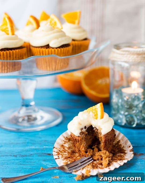 Carrot and Orange Cupcakes with Zesty Cream Cheese Frosting 5 Moist and fluffy carrot & orange cupcakes with a hint of spice and lots of juicy raisins. All topped off with a zesty cream cheese frosting and orange wedges.