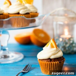Carrot and Orange Cupcakes with Zesty Cream Cheese Frosting 6 Moist and fluffy carrot & orange cupcakes with a hint of spice and lots of juicy raisins. All topped off with a zesty cream cheese frosting and orange wedges.
