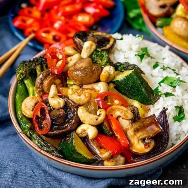 Crispy Thai-Style Sweet Potato Skins with Spicy Peanut Dip 9 Bowl of vegetables in asian-style sauce with rice, cashew nuts and chopped chillies.