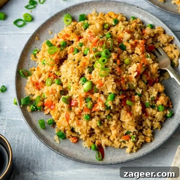 Nasi Goreng: Authentic Indonesian Fried Rice Recipe & Tips 11 Cauliflower fried rice on a grey plate