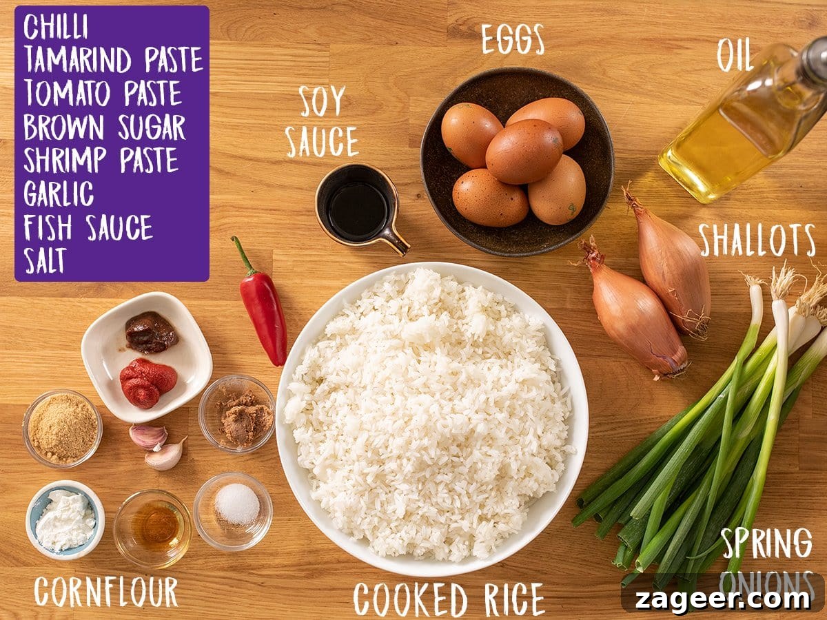 Nasi Goreng: Authentic Indonesian Fried Rice Recipe & Tips 4 Ingredients for nasi goreng on a wooden table