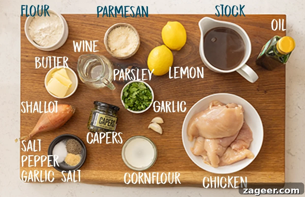 Ingredients for lemon chicken piccata on a wooden board with a text overlay showing ingredient names.