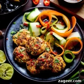 Thai Fishcake Bites and vegetable ribbons on a dark plate