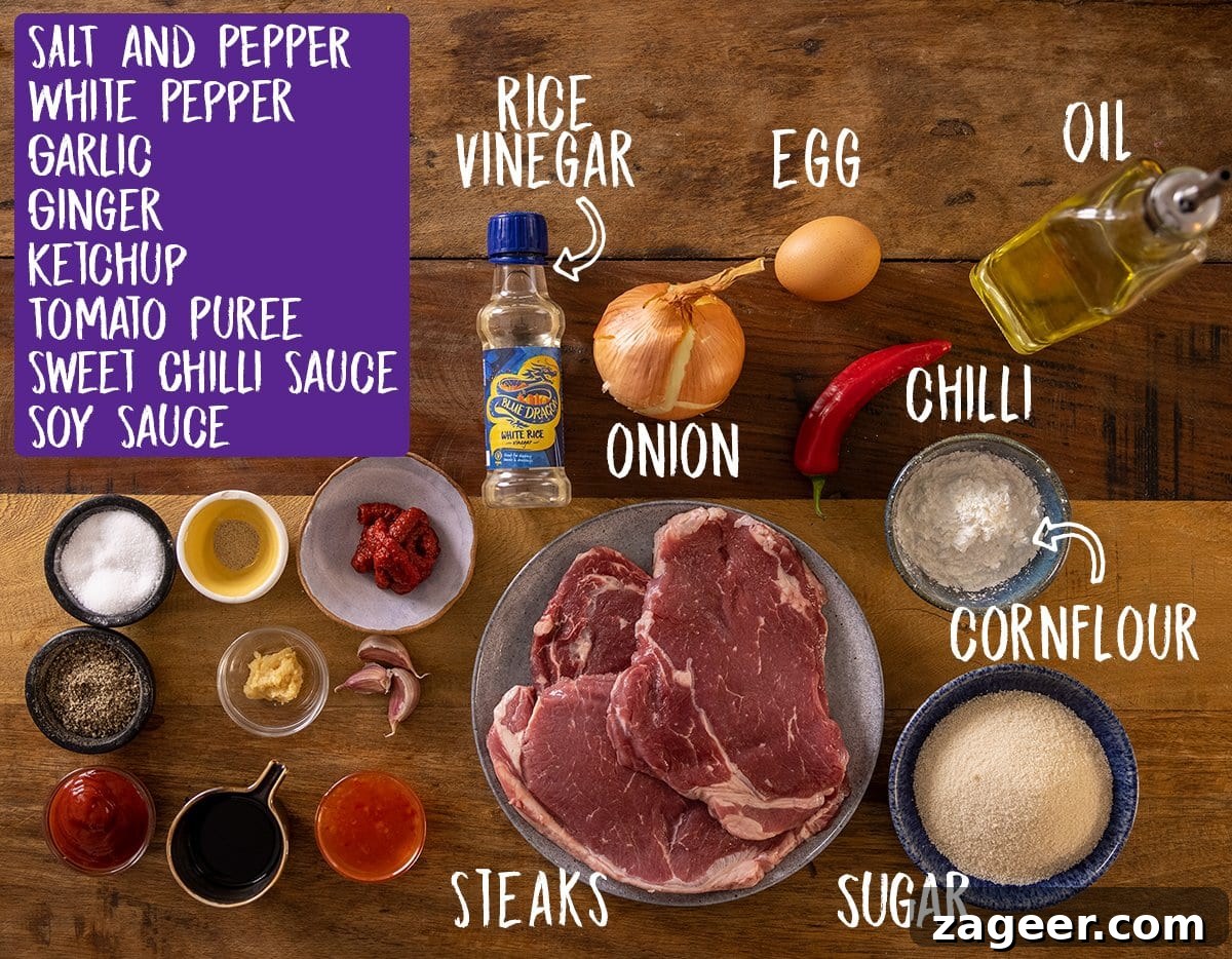 Crispy Chilli Beef Recipe with Sticky Sweet-Spicy Sauce 3 Ingredients for crispy chilli beef on a wooden table