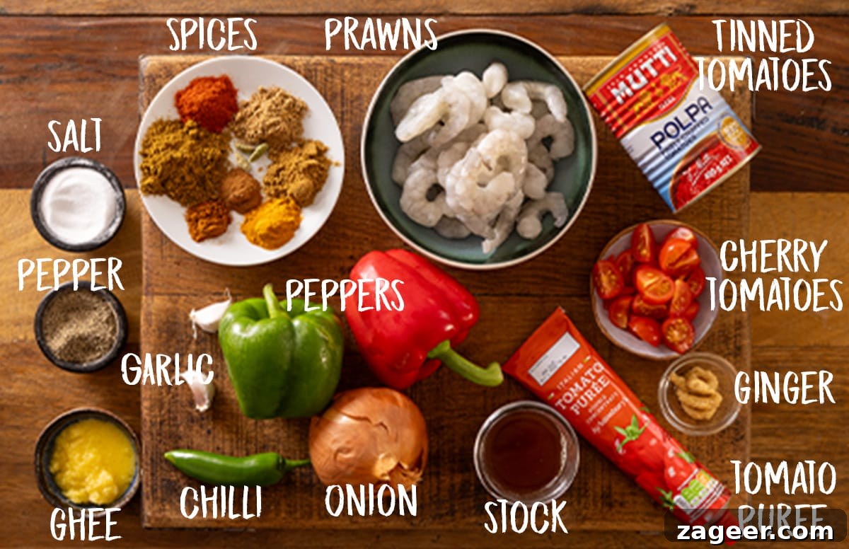 Prawn Balti Curry Recipe: Flavorful Indian-Style Shrimp Curry 3 Picture of labelled ingredients for a prawn balti curry on a wooden board.