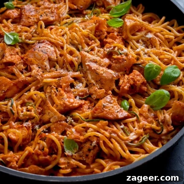 Crispy Air Fryer Teriyaki Salmon Recipe in 20 Minutes 10 Spaghetti and pieces of salmon on a creamy tomato sauce in a pan