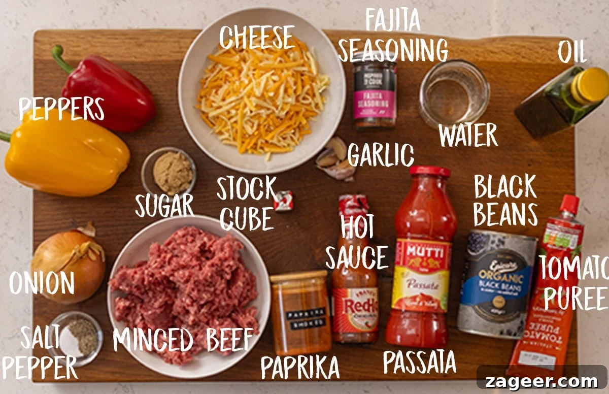 Tex‑Mex Minced Beef Recipe: Flavorful Beef for Tacos & Bowls 4 An overhead shot of the ingredients for Tex-Mex Minced Beef arranged on a wooden cutting board.