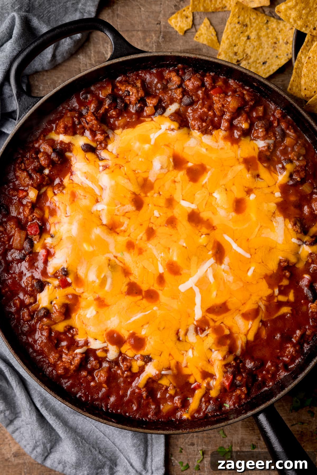 Tex‑Mex Minced Beef Recipe: Flavorful Beef for Tacos & Bowls 6 An overhead shot of Tex-Mex minced beef in a black cast iron pan with cheese on top.