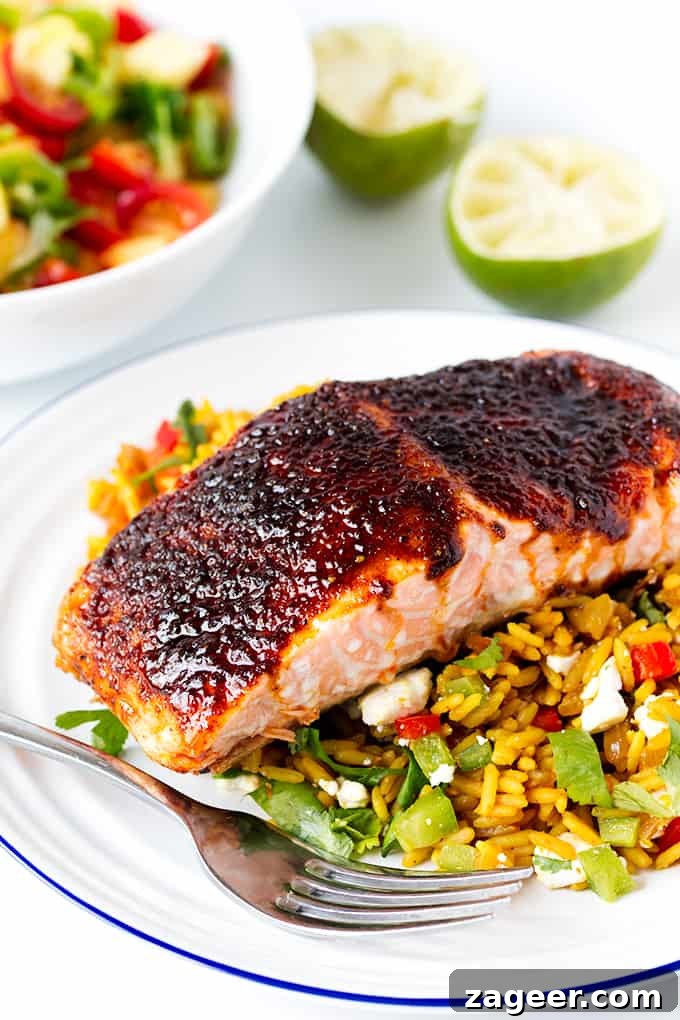 Sugar-Spiced Salmon with Herbed Pilaf Recipe 2 Spiced caramelised salmon served on a bed of savoury rice with feta and veggies. Colourful, healthy and delicious!
