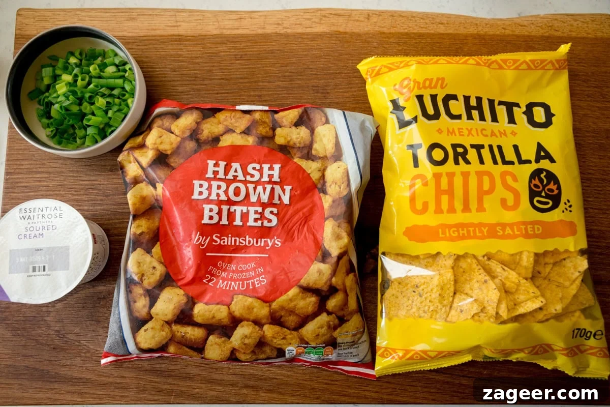 Loaded Totchos: Crispy Hash Brown Bites with Cheesy Toppings 4 The ingredients for the Loaded Tocho fixings are laid out on a wooden board