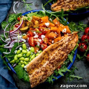 Salad bowl filled with roasted veg, tomatoes, edamame, red onion, courgette and topped with honey mustard trout.